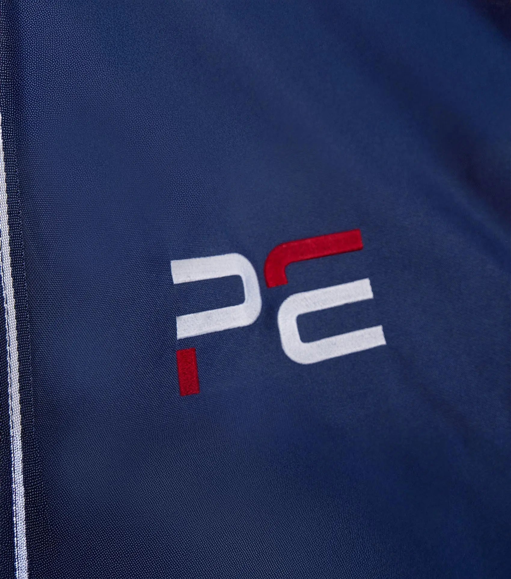 PE Team Stable Drape Navy by Premier Equine Int. Ltd. at  Try A Bit